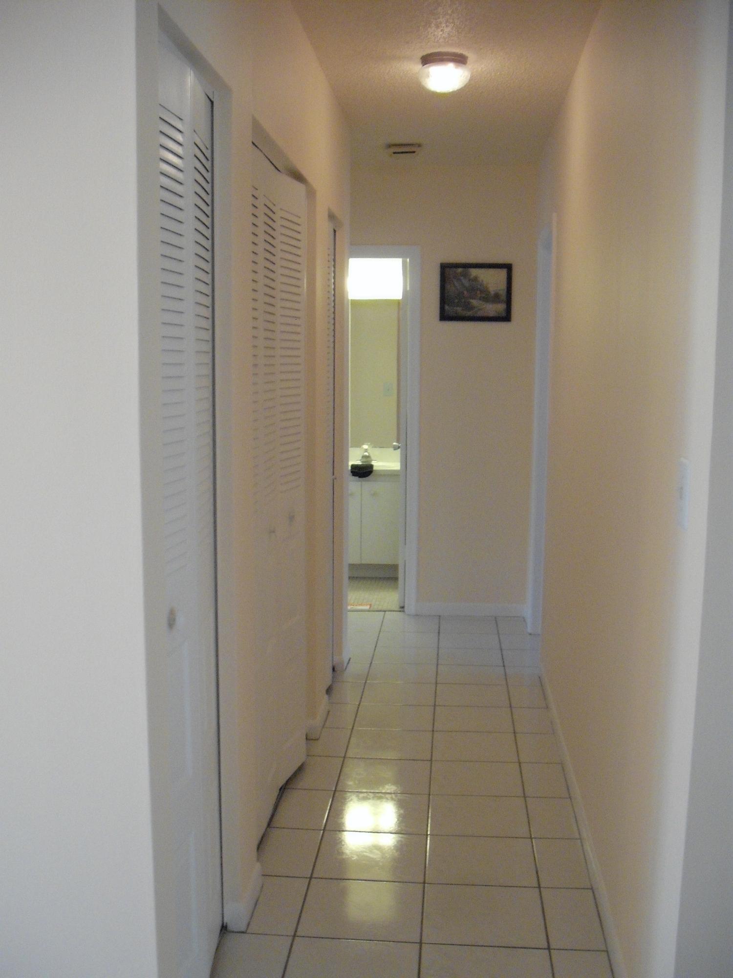 18075 102nd Way South Boca Raton, FL 33498 - Photo 11 of 37 Hallway with 3 closets