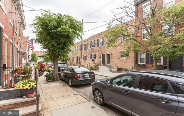 a view of a street with cars