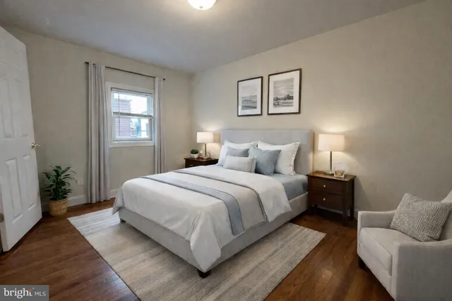 a bedroom with a bed and a couch