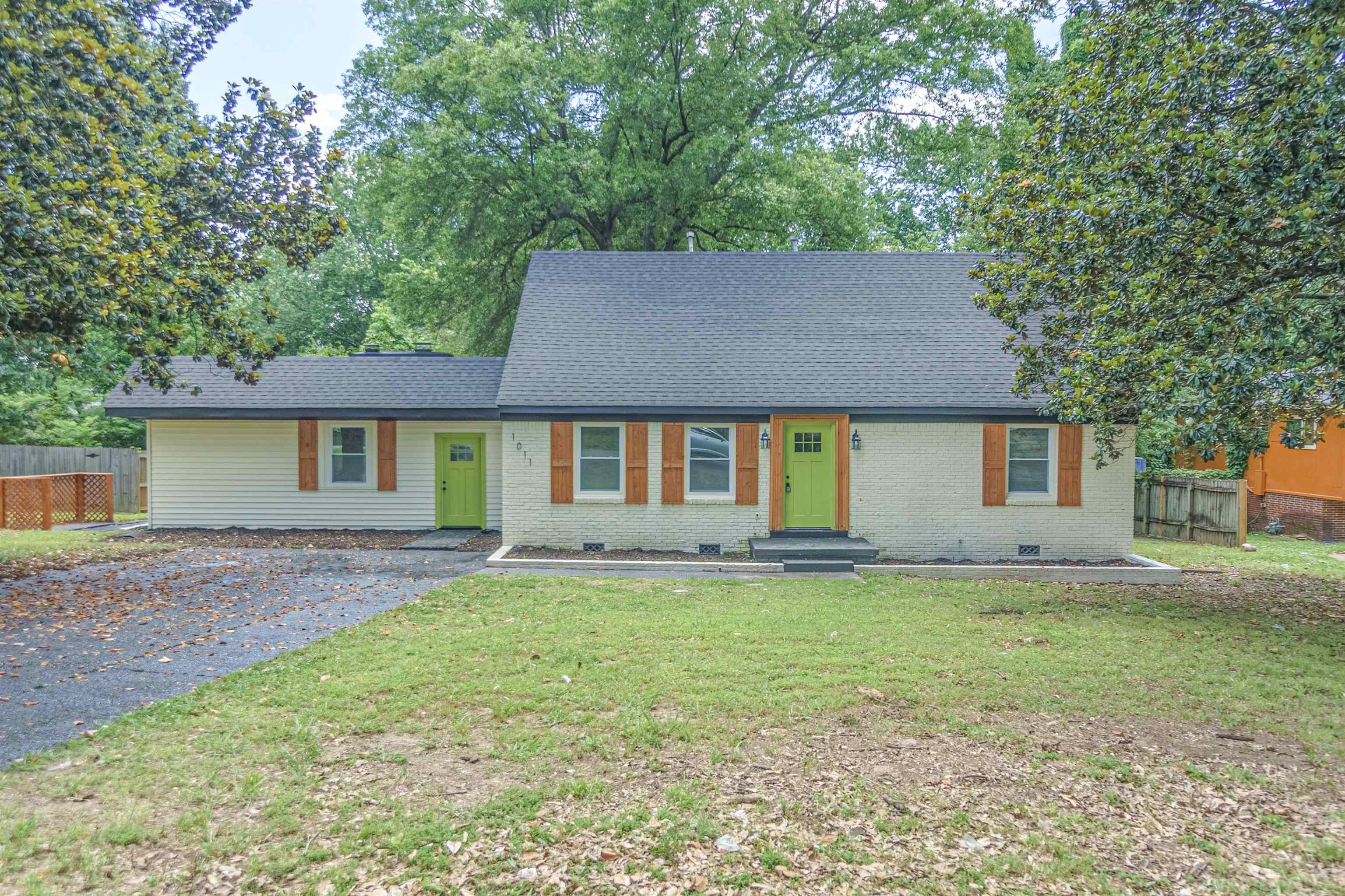 1011 Haledale Road Memphis, TN 38116 - Photo 1 of 25 a house that has a big yard in front of it