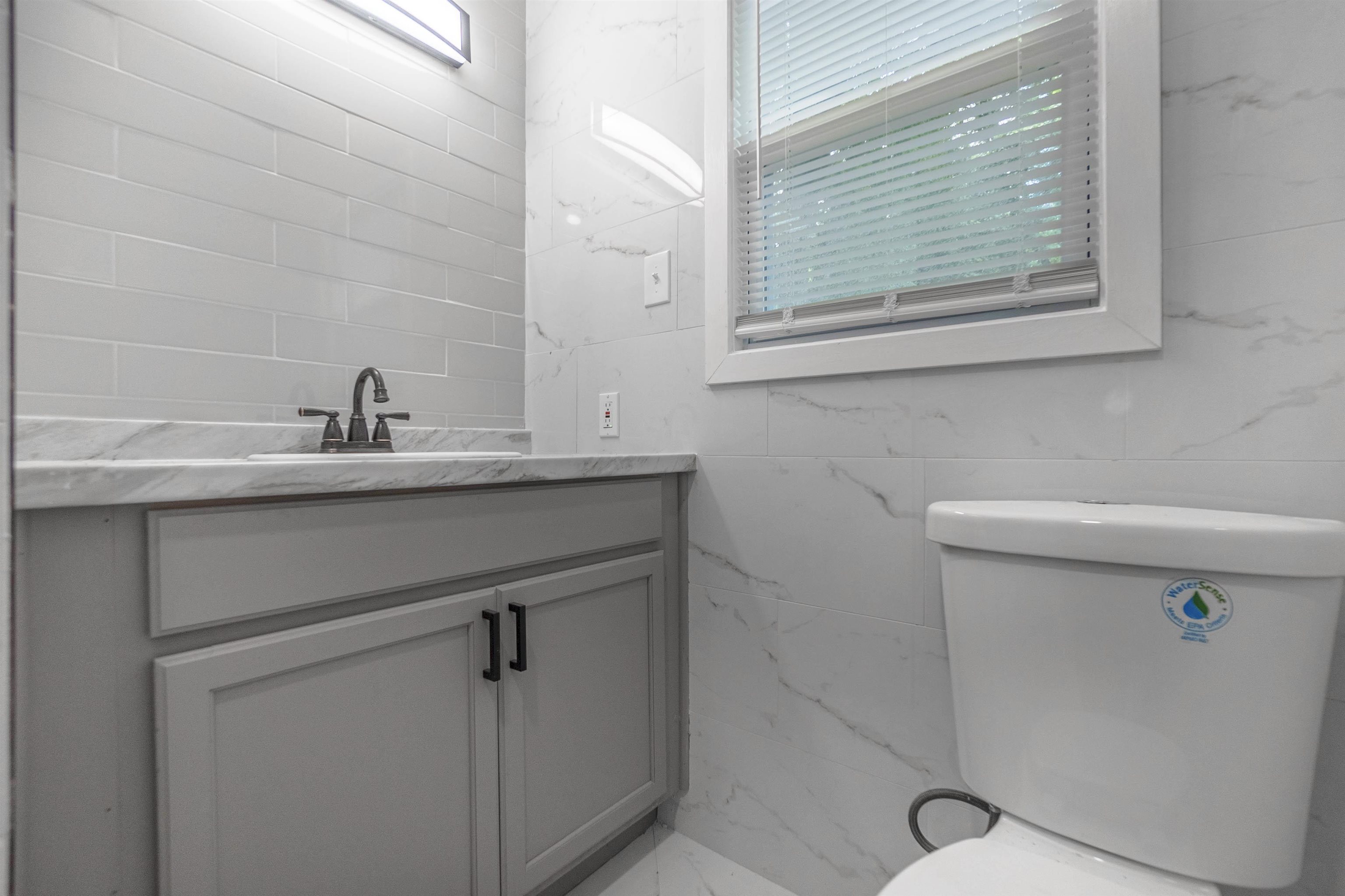 1011 Haledale Road Memphis, TN 38116 - Photo 20 of 25 a close up of a sink and a mirror