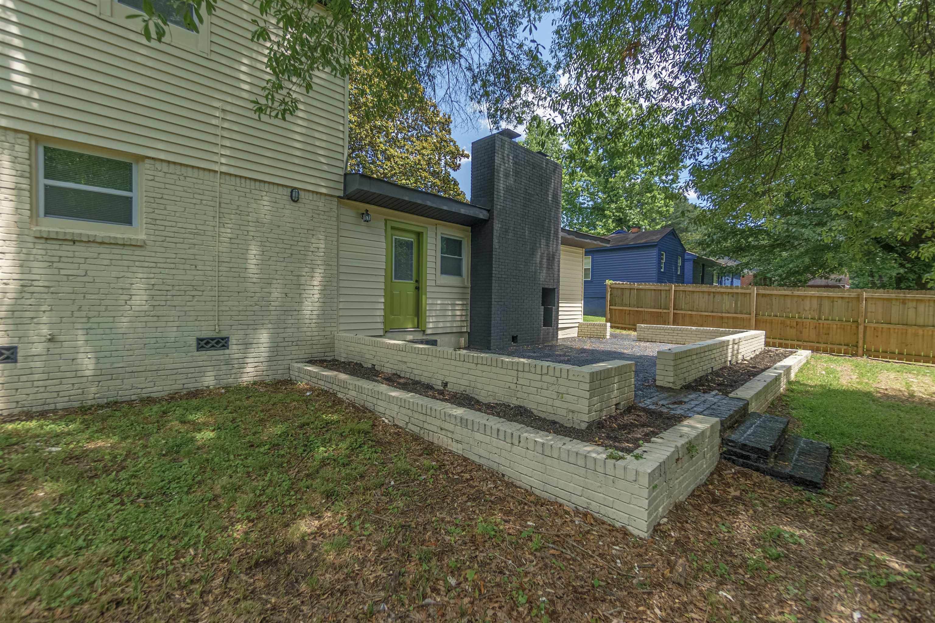 1011 Haledale Road Memphis, TN 38116 - Photo 25 of 25 a view of a house with backyard and sitting area