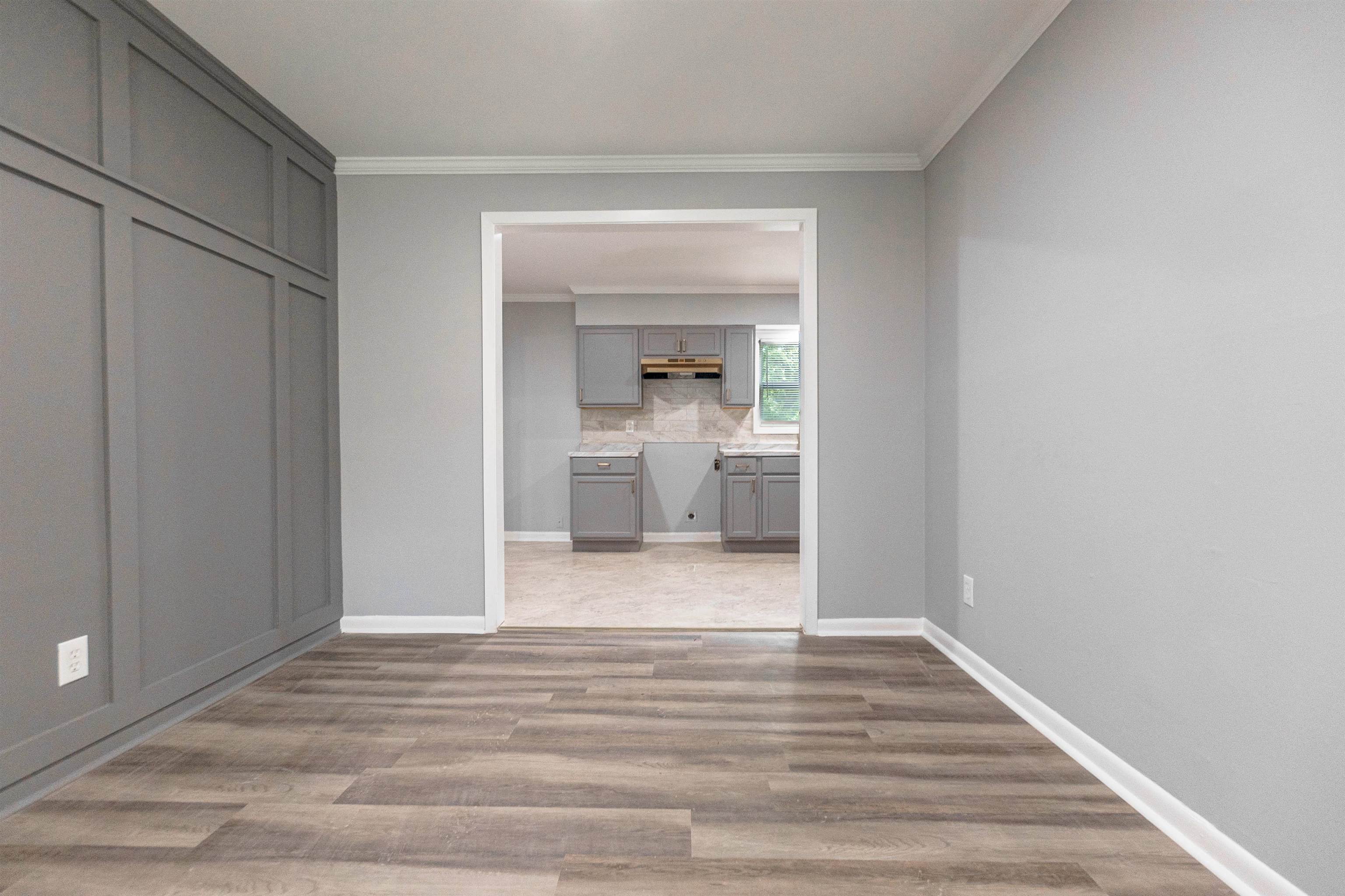 1011 Haledale Road Memphis, TN 38116 - Photo 5 of 25 a view of a hallway to a room and wooden floor