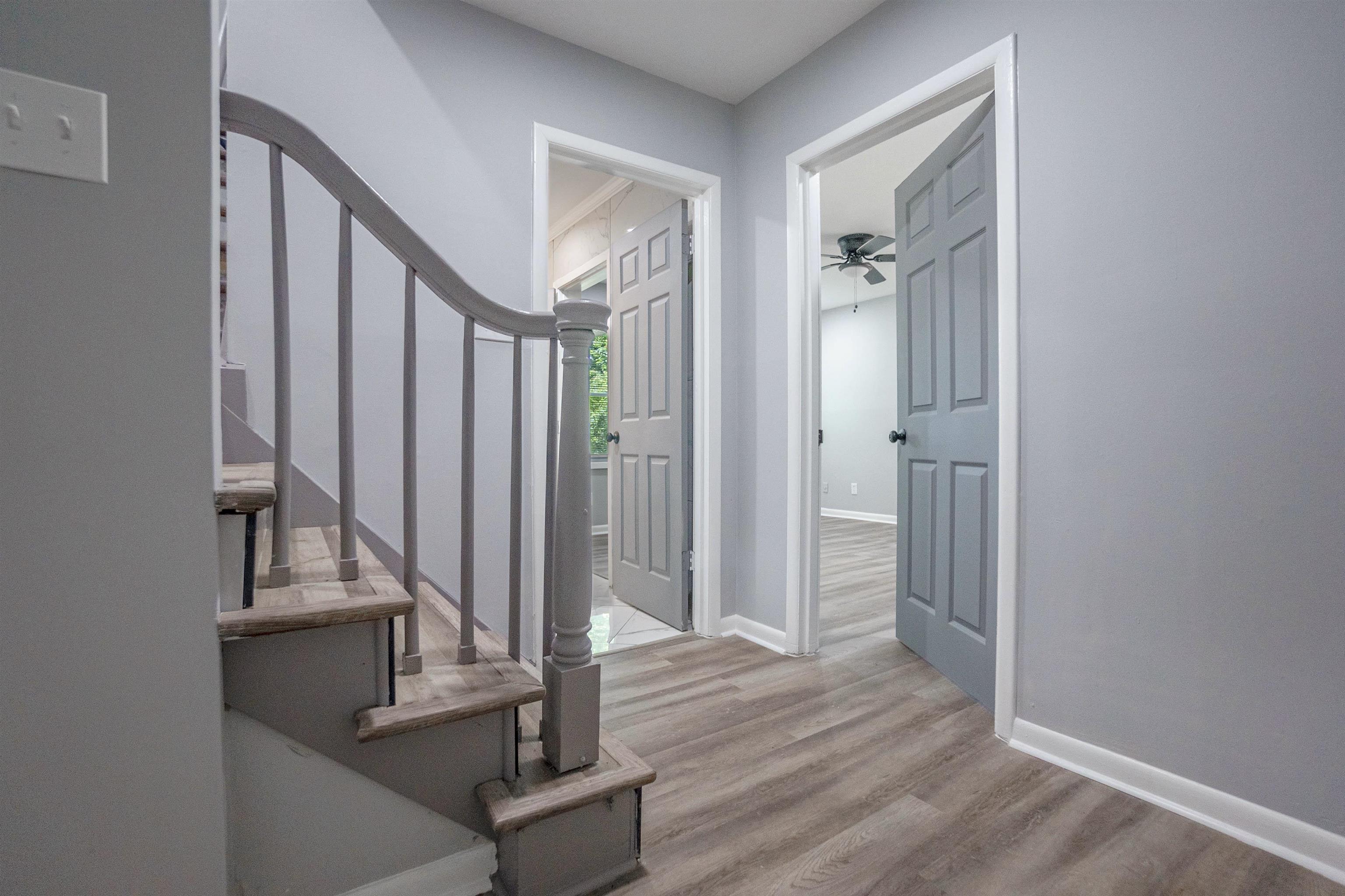 1011 Haledale Road Memphis, TN 38116 - Photo 8 of 25 a view of front door with hallway and wooden floor