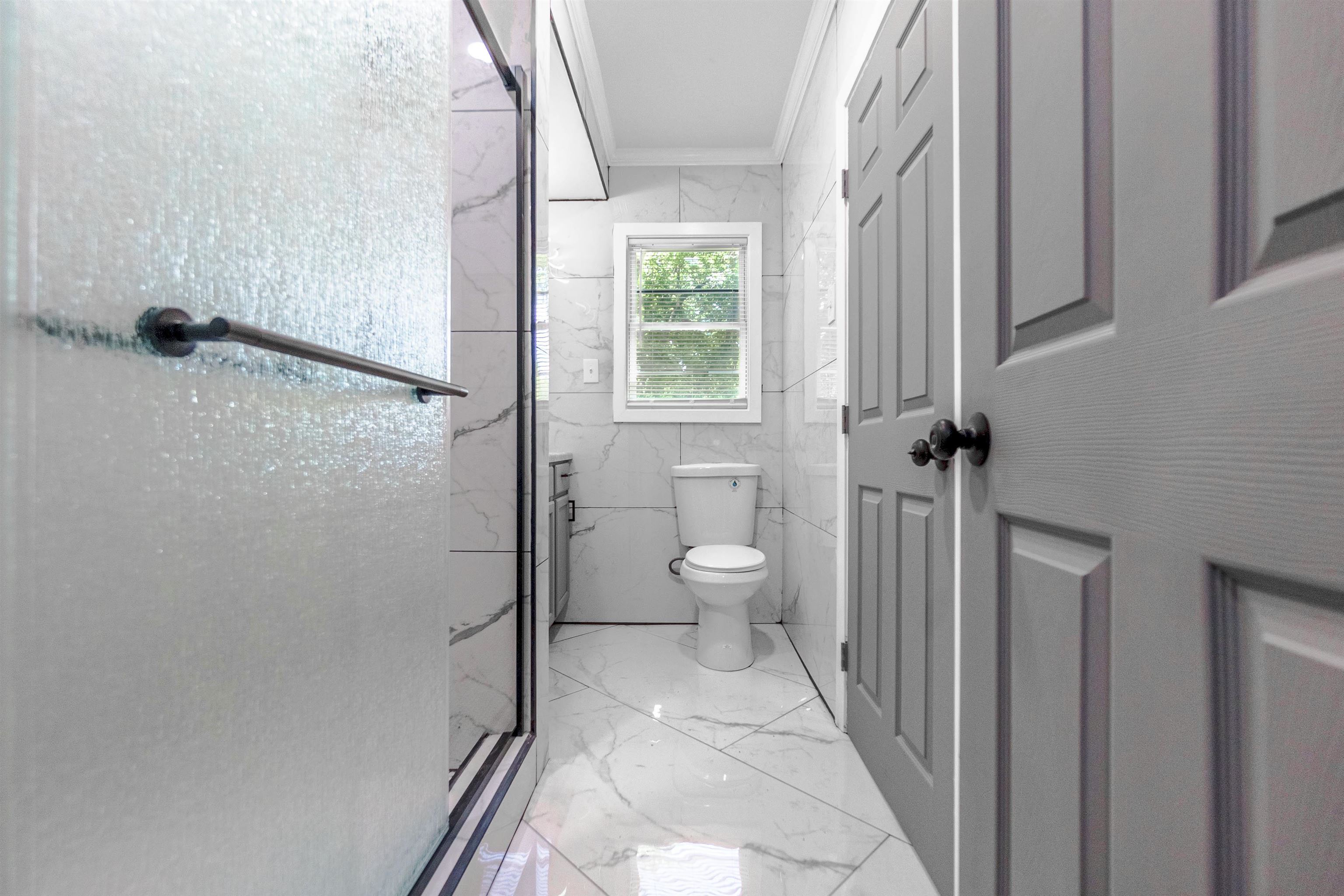 1011 Haledale Road Memphis, TN 38116 - Photo 10 of 25 a bathroom with a granite countertop shower a toilet and a sink