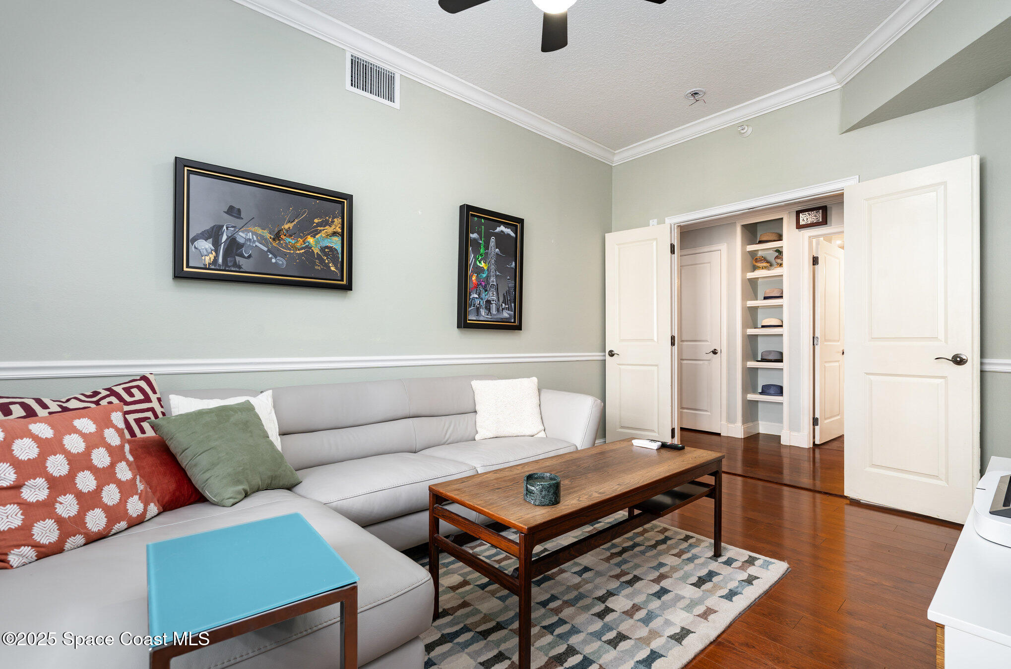 29 Riverside Drive, Unit 203 Cocoa, FL 32922 - Photo 15 of 33 a living room with furniture and wooden floor