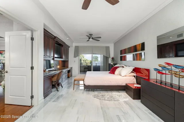 a bed room with a bed and a television