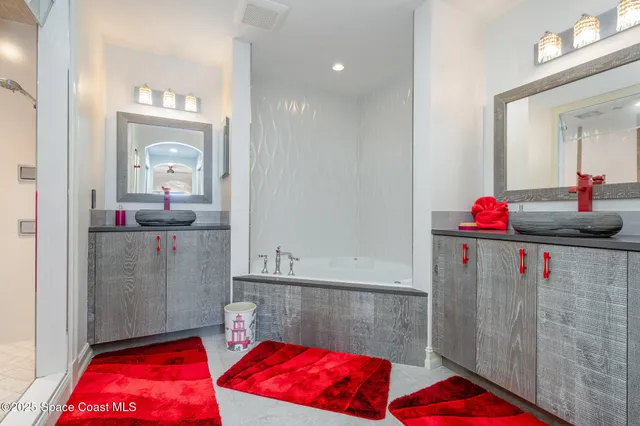 a bedroom with a bed and a mirror