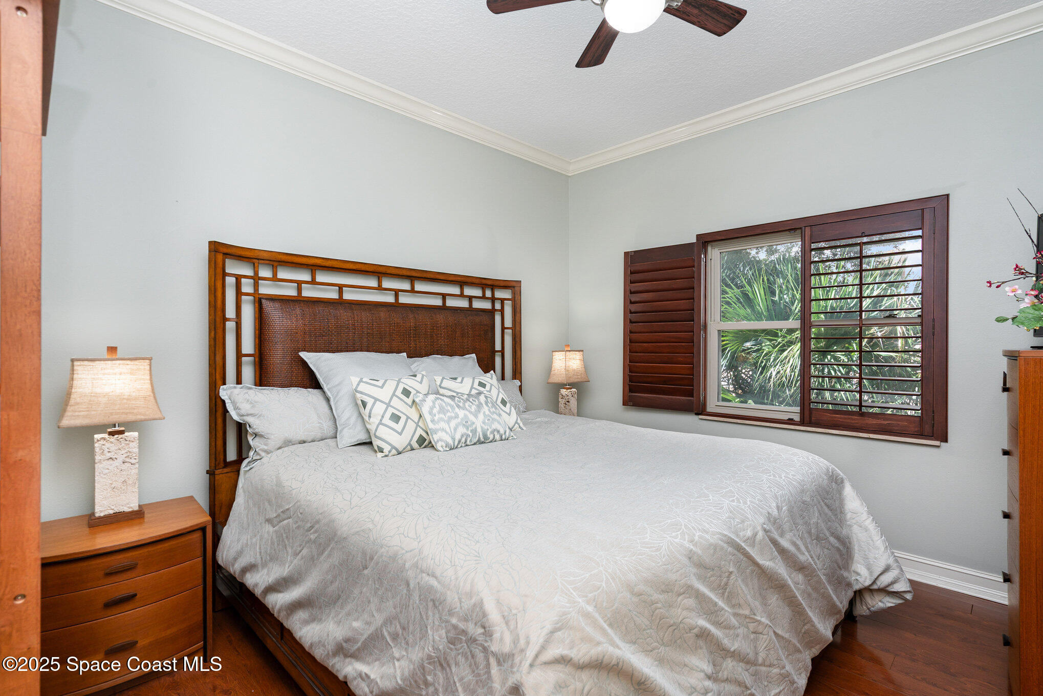 29 Riverside Drive, Unit 203 Cocoa, FL 32922 - Photo 24 of 33 a bedroom with a bed and a window