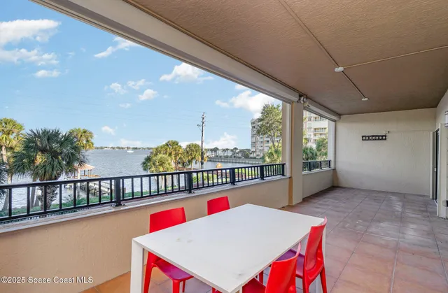 a view of parking garage with cars