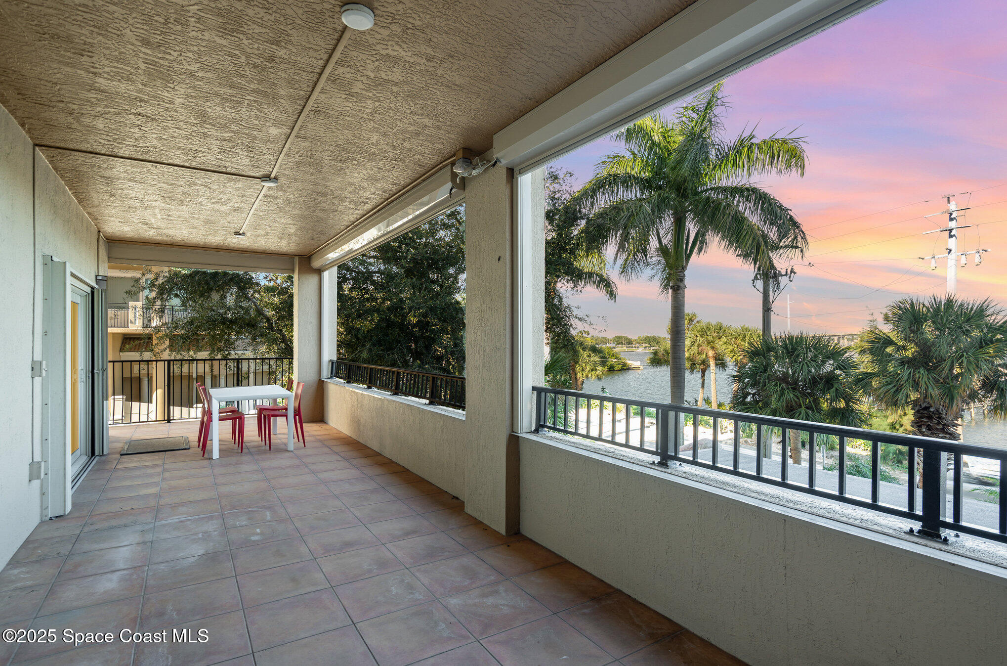 29 Riverside Drive, Unit 203 Cocoa, FL 32922 - Photo 28 of 33 a view of a porch with furniture and a porch