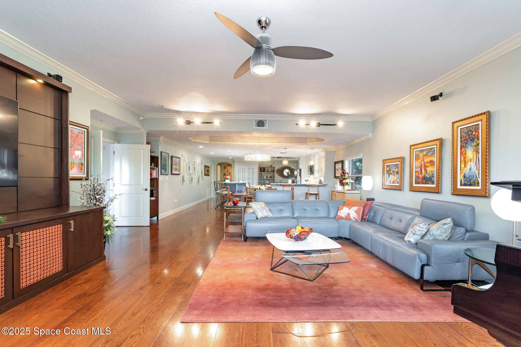 29 Riverside Drive, Unit 203 Cocoa, FL 32922 - Photo 5 of 33 a living room with furniture kitchen view and a large window