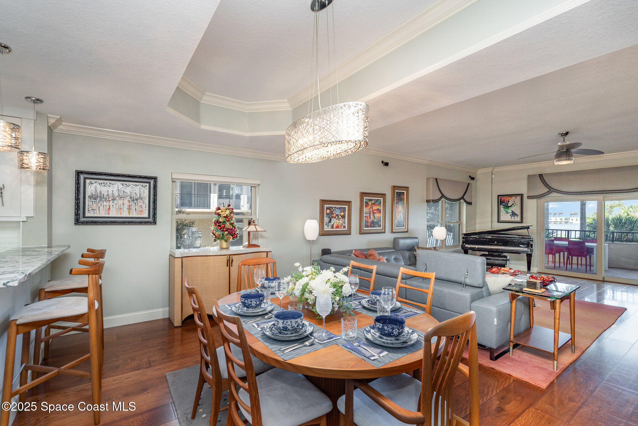 29 Riverside Drive, Unit 203 Cocoa, FL 32922 - Photo 6 of 33 a view of a dining room with furniture and wooden floor