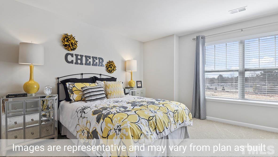 1006 Broadlands Way Graham, NC 27253 - Photo 18 of 25 a bedroom with a bed and a window