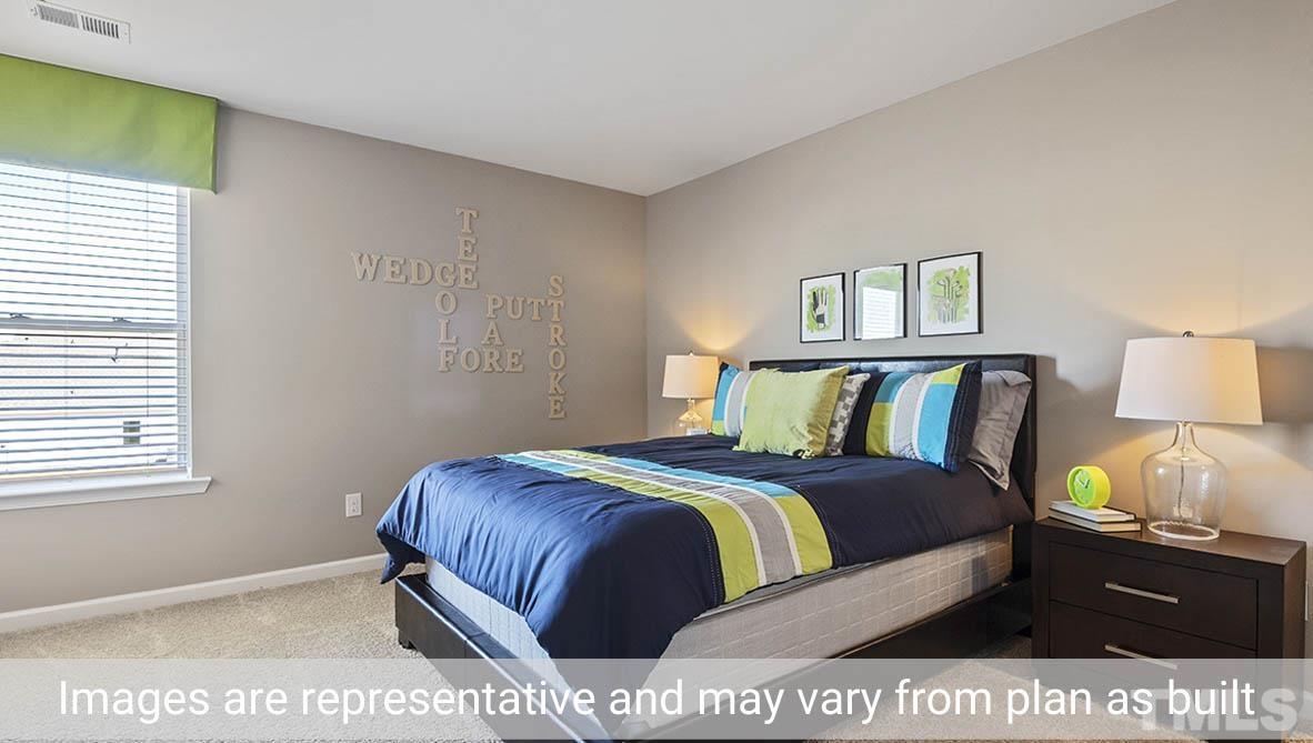 1006 Broadlands Way Graham, NC 27253 - Photo 20 of 25 a bedroom with a bed and painting on the wall