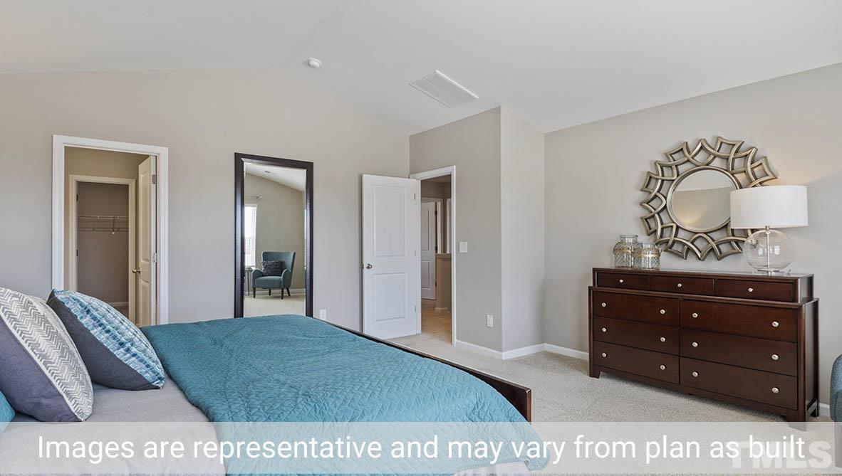 1006 Broadlands Way Graham, NC 27253 - Photo 24 of 25 a view of a bedroom with furniture and cabinet