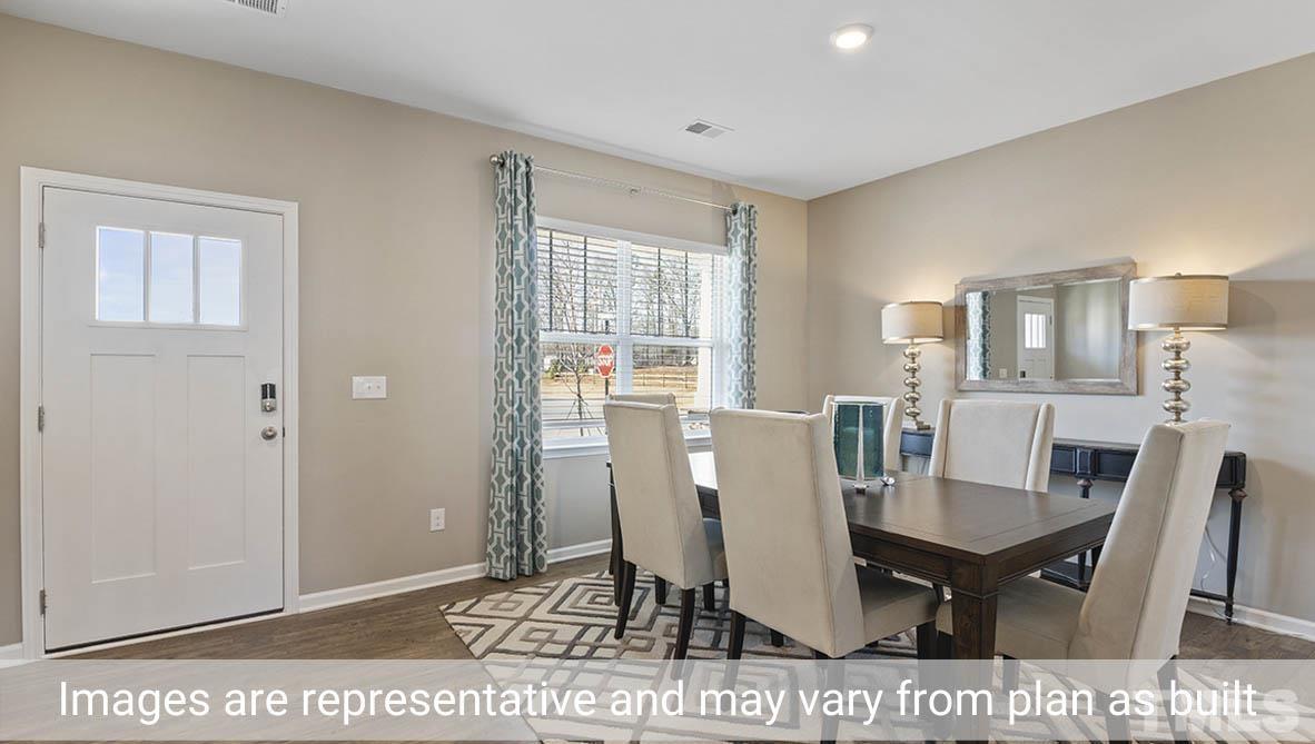 1006 Broadlands Way Graham, NC 27253 - Photo 5 of 25 a view of a dining room with furniture