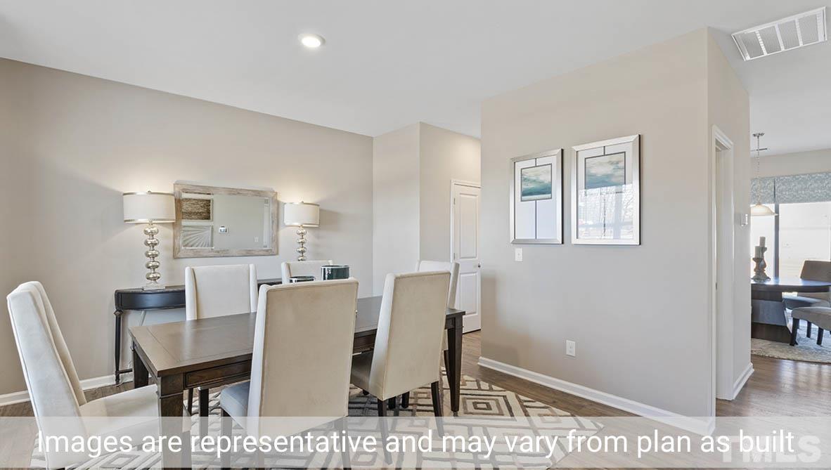 1006 Broadlands Way Graham, NC 27253 - Photo 6 of 25 a view of a dining room with furniture and wooden floor