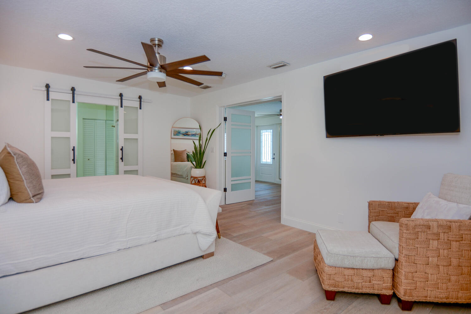 3396 Pebble Place Jupiter, FL 33469 - Photo 14 of 24 a spacious bedroom with a bed and a flat screen television