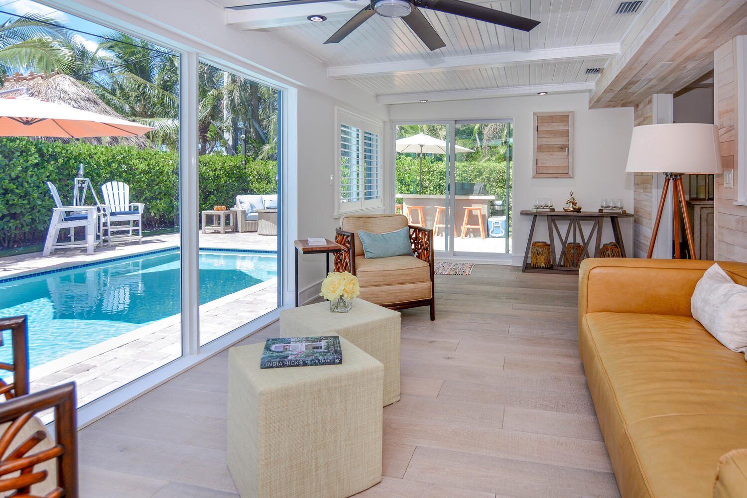 3396 Pebble Place Jupiter, FL 33469 - Photo 5 of 24 a living room with furniture and a floor to ceiling window