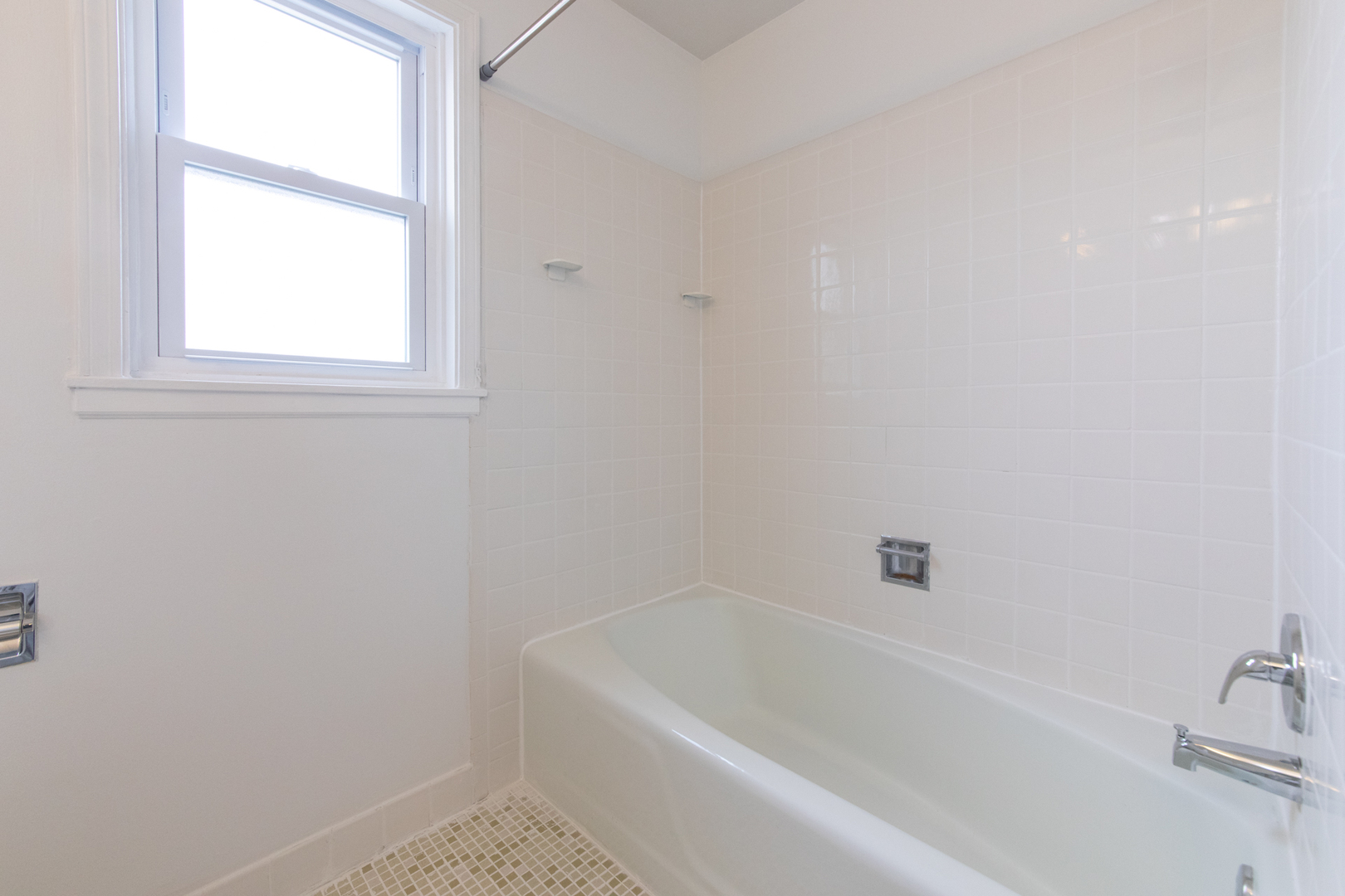 2148 Rugen Road, Unit B Glenview, IL 60026 - Photo 16 of 23 a white bath tub sitting next to a window