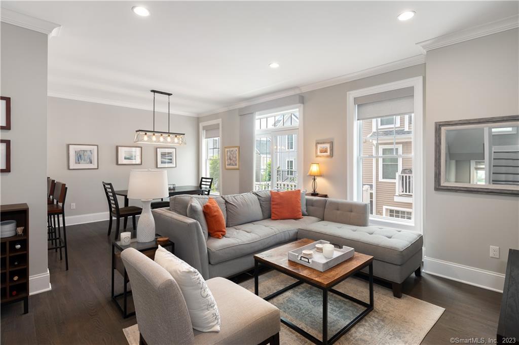 a living room with furniture a table and a window