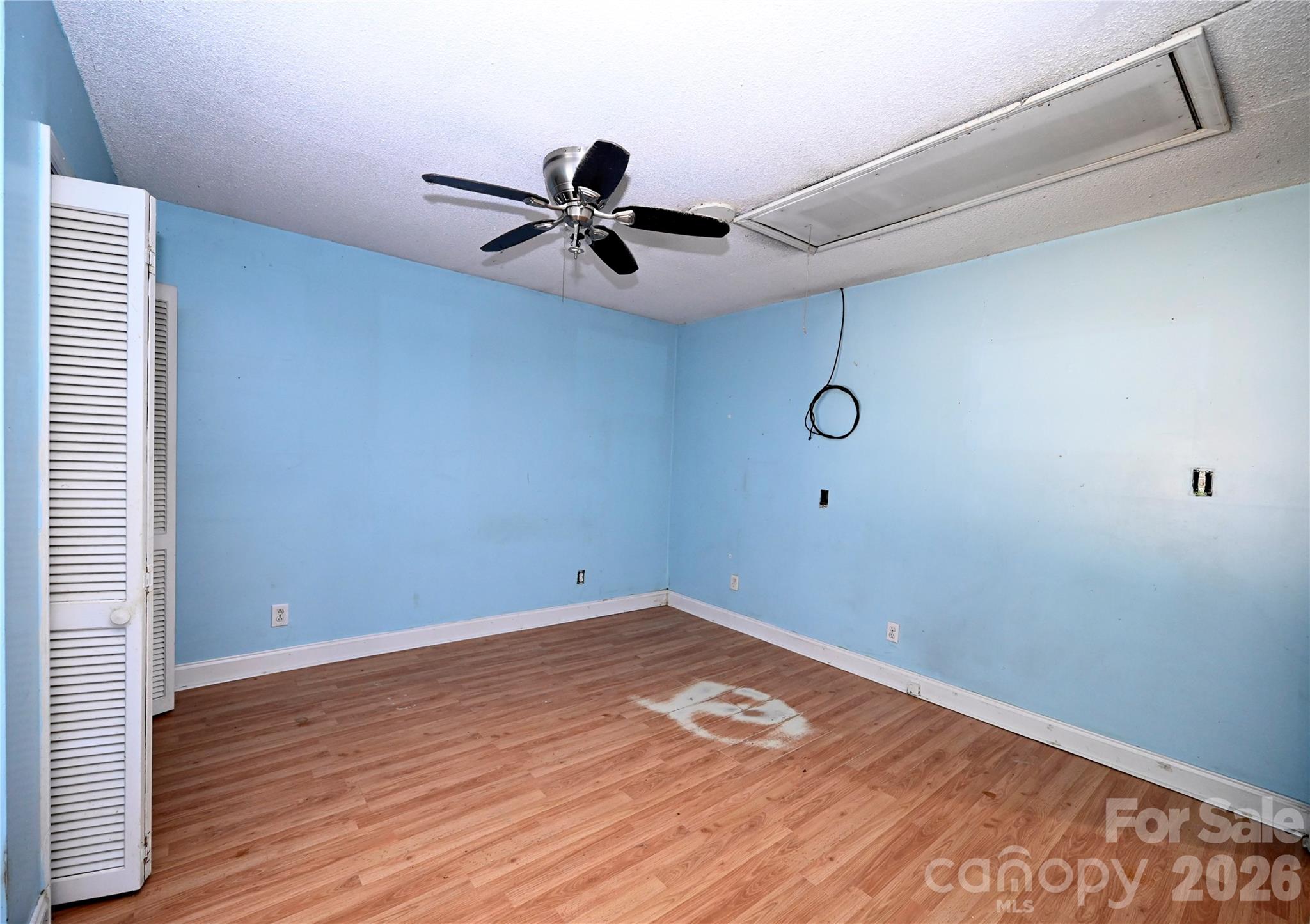 1845 State Rd S-46-149 Clover, SC 29710 - Photo 24 of 28 a view of a room with wooden floor and fan