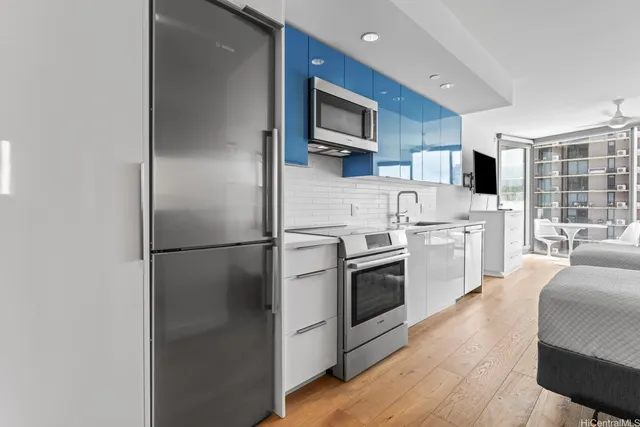 a kitchen with a refrigerator stove and sink