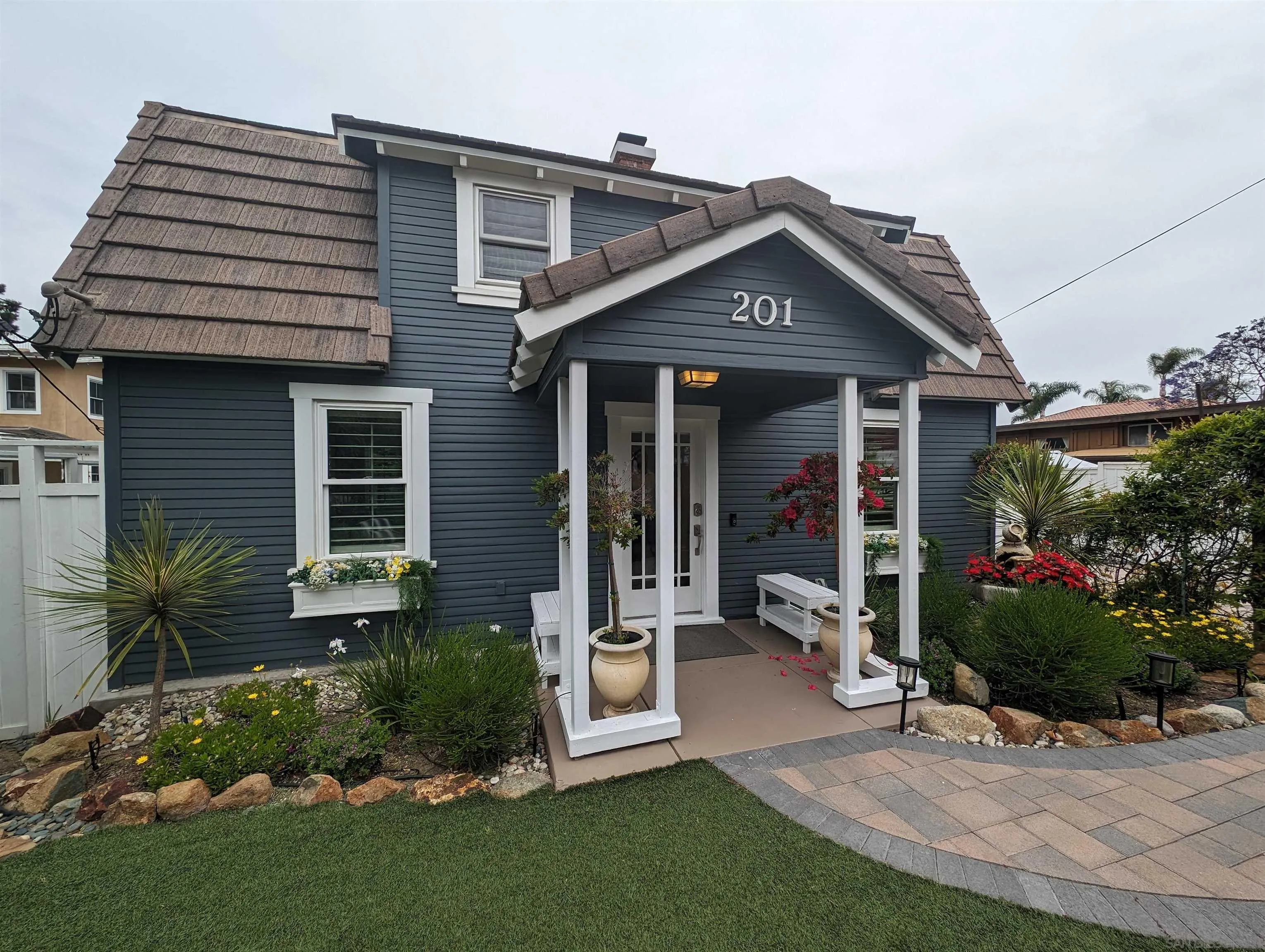 201 North Rios Avenue Solana Beach, CA 92075 - Photo 2 of 5 a front view of a house with garden