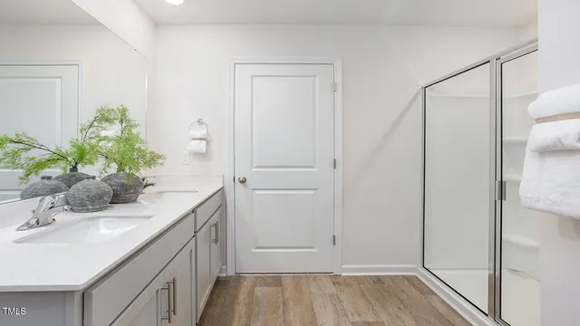 a bathroom with a sink a vanity and a mirror