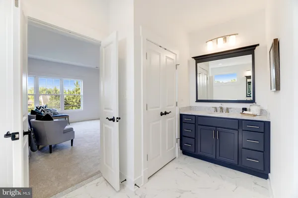 a living room with furniture and a large mirror