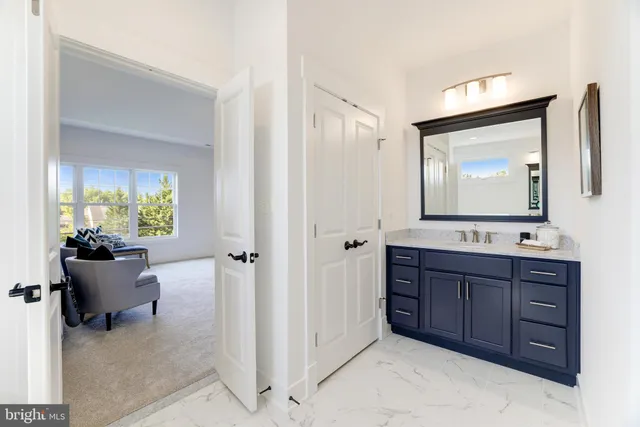 a living room with furniture and a large mirror