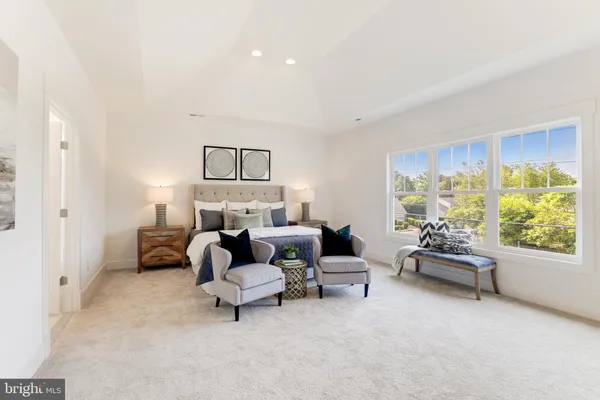 a bed room with furniture and a window