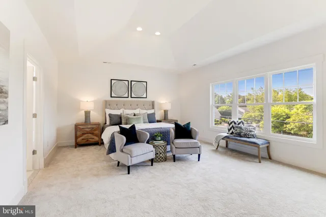 a bed room with furniture and a window