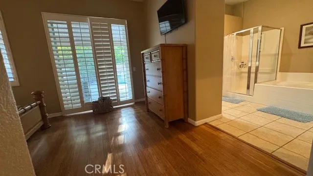 a view of a hardwood floor and staircase