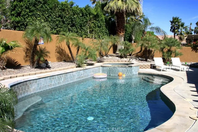 a view of a swimming pool with a patio