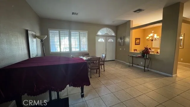 a view of a big room with furniture and windows