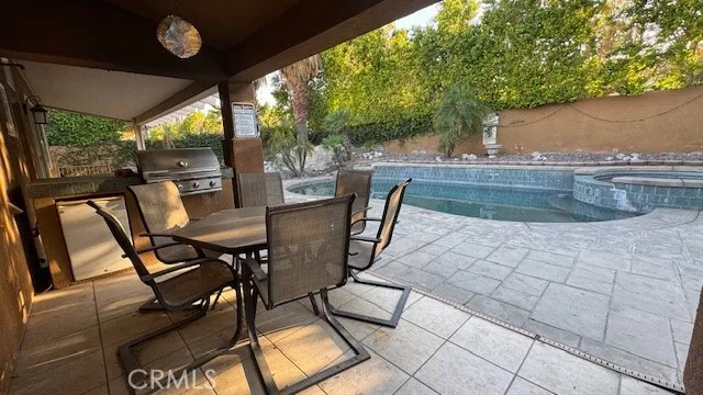a view of a chairs and table in the patio