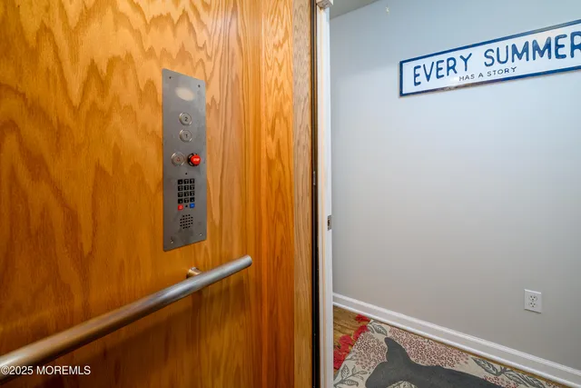a bathroom with a shower and a mirror