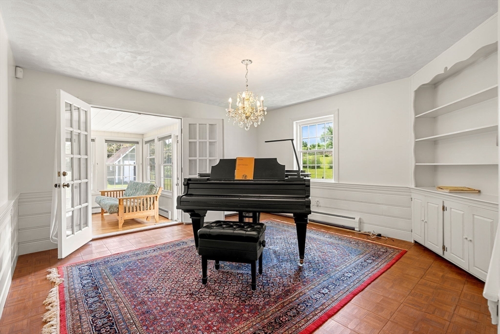 61 Turkey Hill Road West Newbury, MA 01985 - Photo 14 of 42 a living room with furniture and a piano table