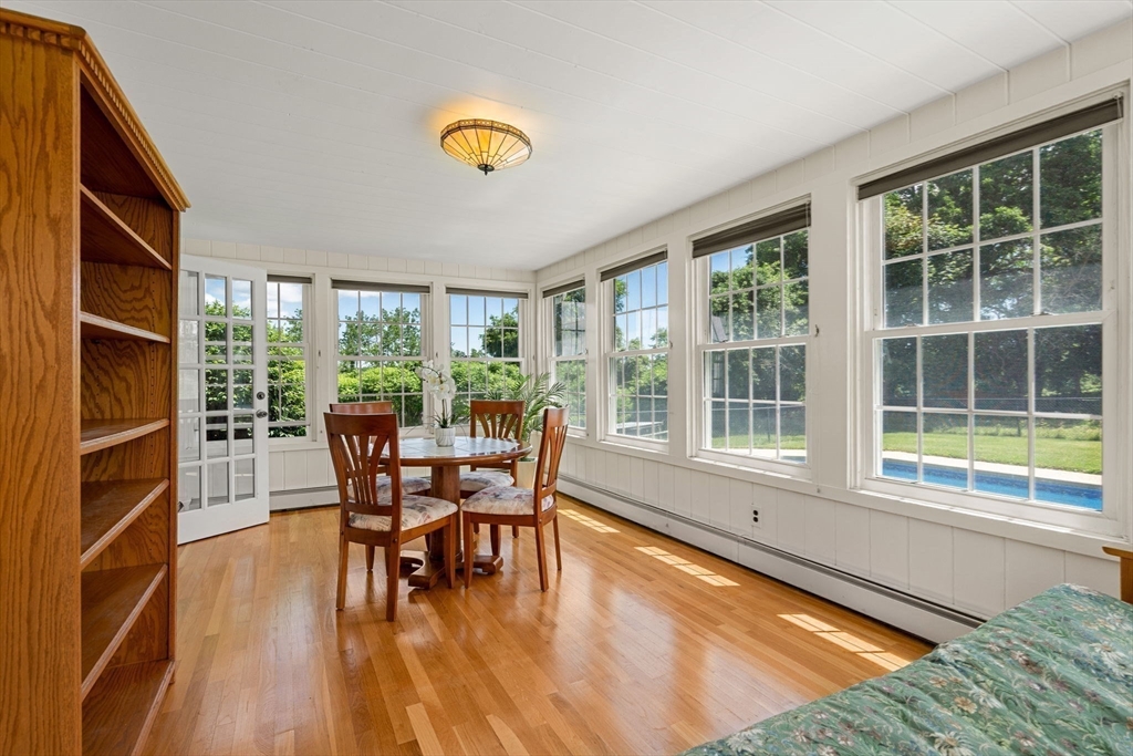 61 Turkey Hill Road West Newbury, MA 01985 - Photo 15 of 42 a view of a dining room with furniture and a window