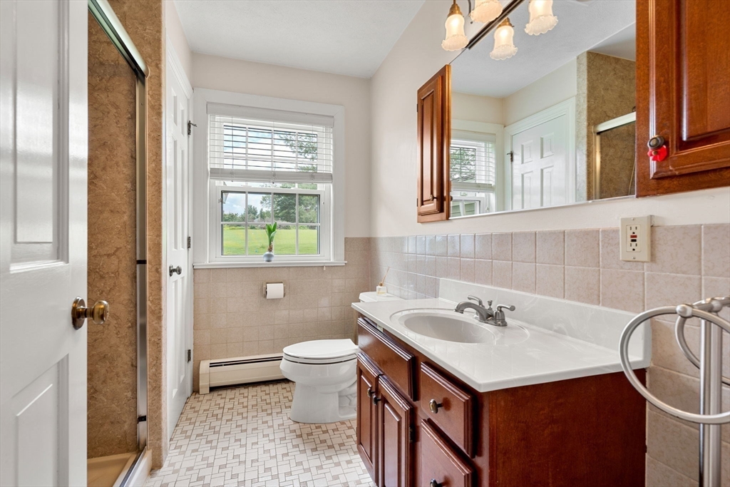 61 Turkey Hill Road West Newbury, MA 01985 - Photo 19 of 42 a bathroom with a sink and a mirror