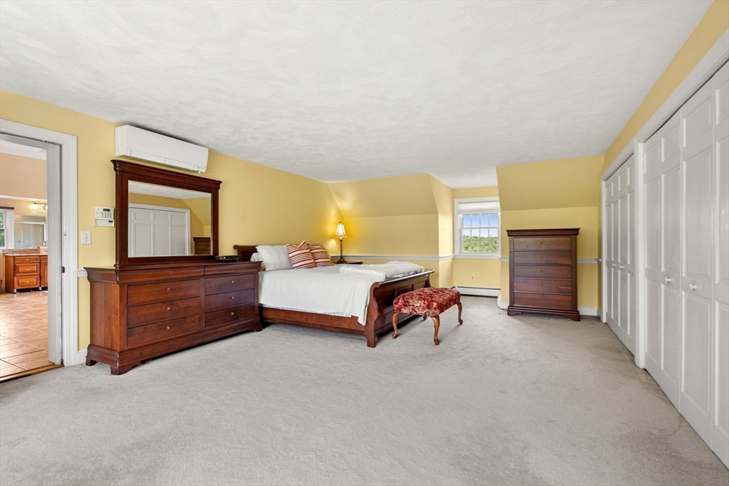 61 Turkey Hill Road West Newbury, MA 01985 - Photo 24 of 42 a bedroom with a bed and a window