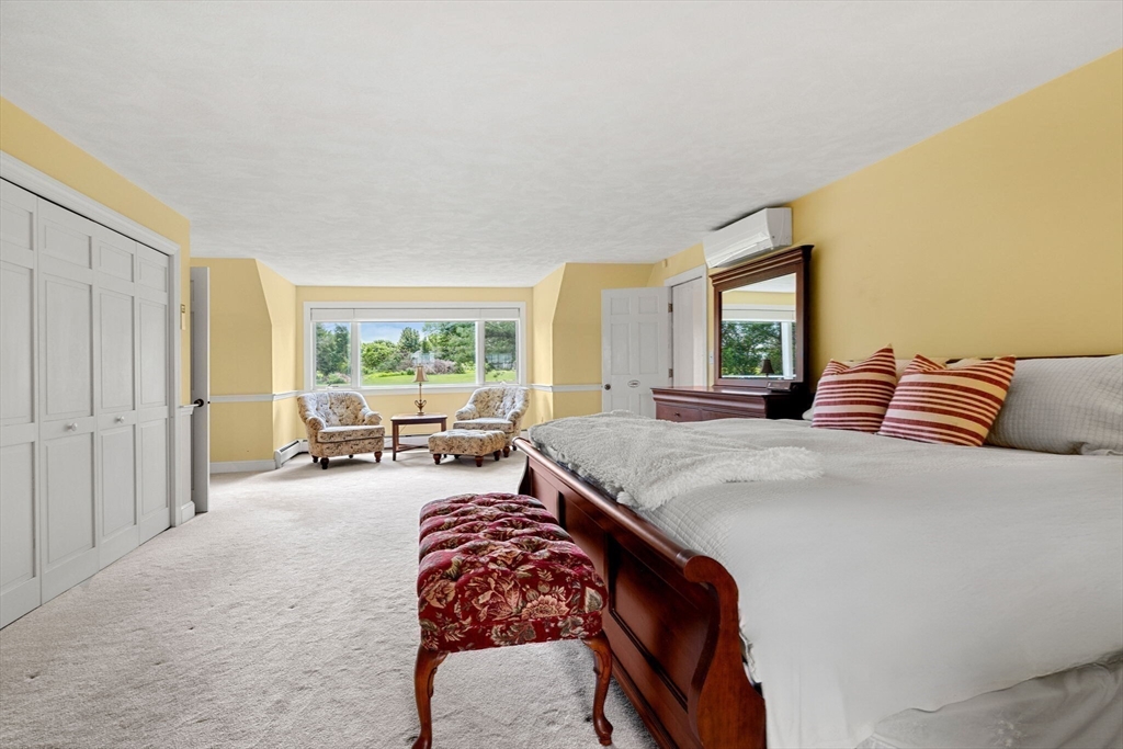 61 Turkey Hill Road West Newbury, MA 01985 - Photo 25 of 42 a spacious bedroom with a bed and large windows