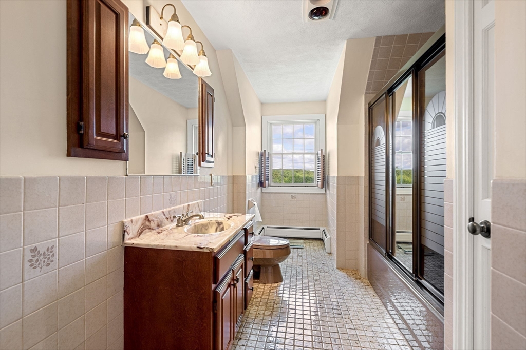 61 Turkey Hill Road West Newbury, MA 01985 - Photo 32 of 42 a bathroom with a sink and a mirror