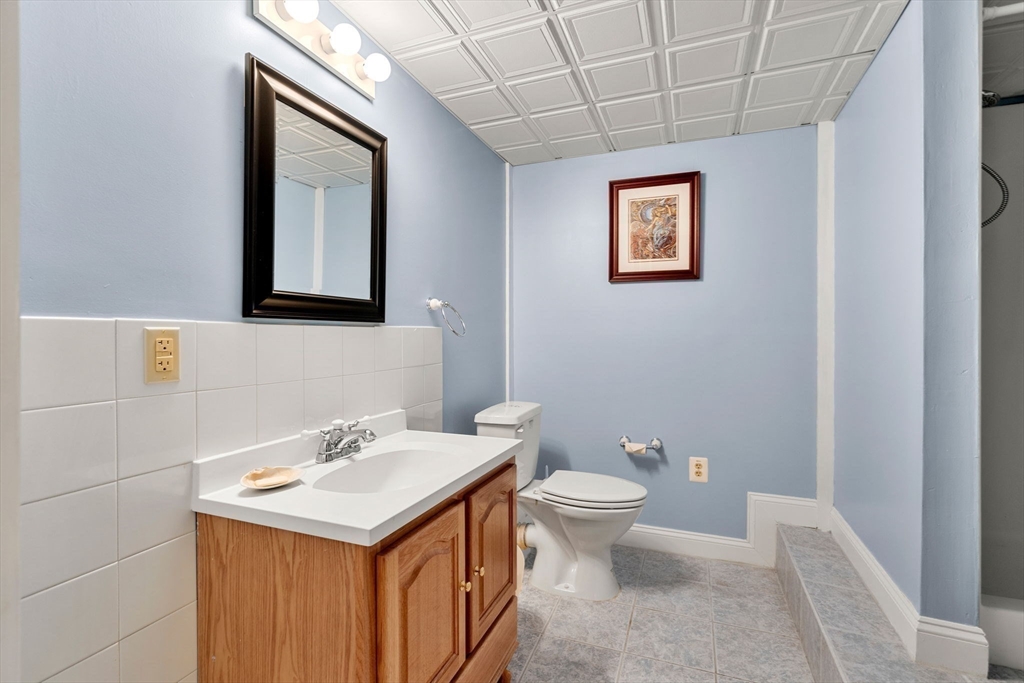 61 Turkey Hill Road West Newbury, MA 01985 - Photo 36 of 42 a bathroom with a toilet sink and mirror