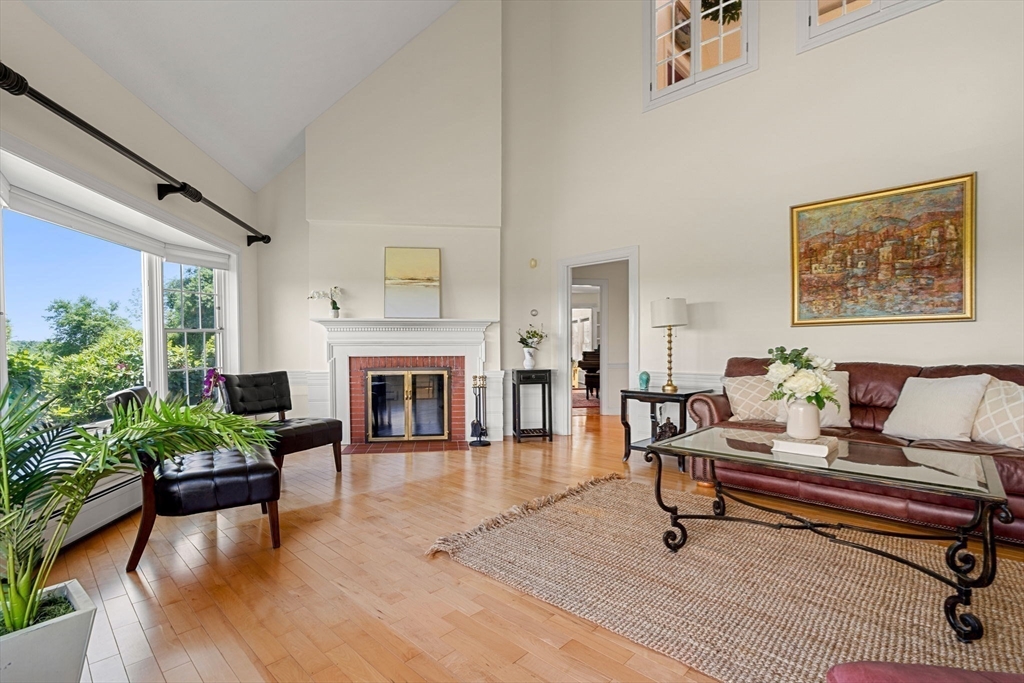 61 Turkey Hill Road West Newbury, MA 01985 - Photo 7 of 42 a living room with furniture and a fireplace
