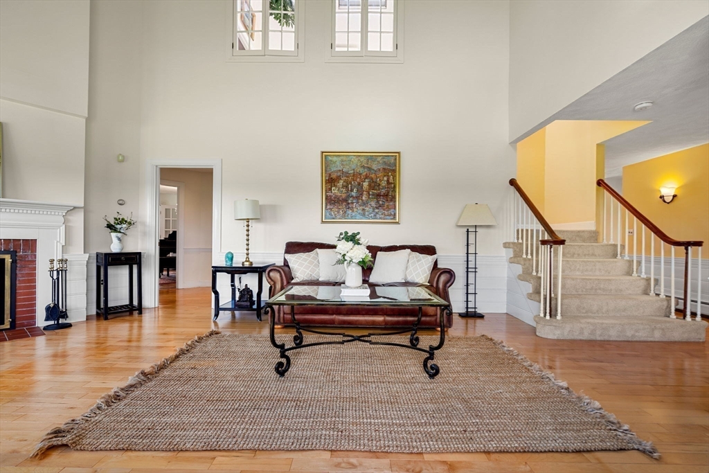61 Turkey Hill Road West Newbury, MA 01985 - Photo 8 of 42 a living room with furniture and a wooden floor