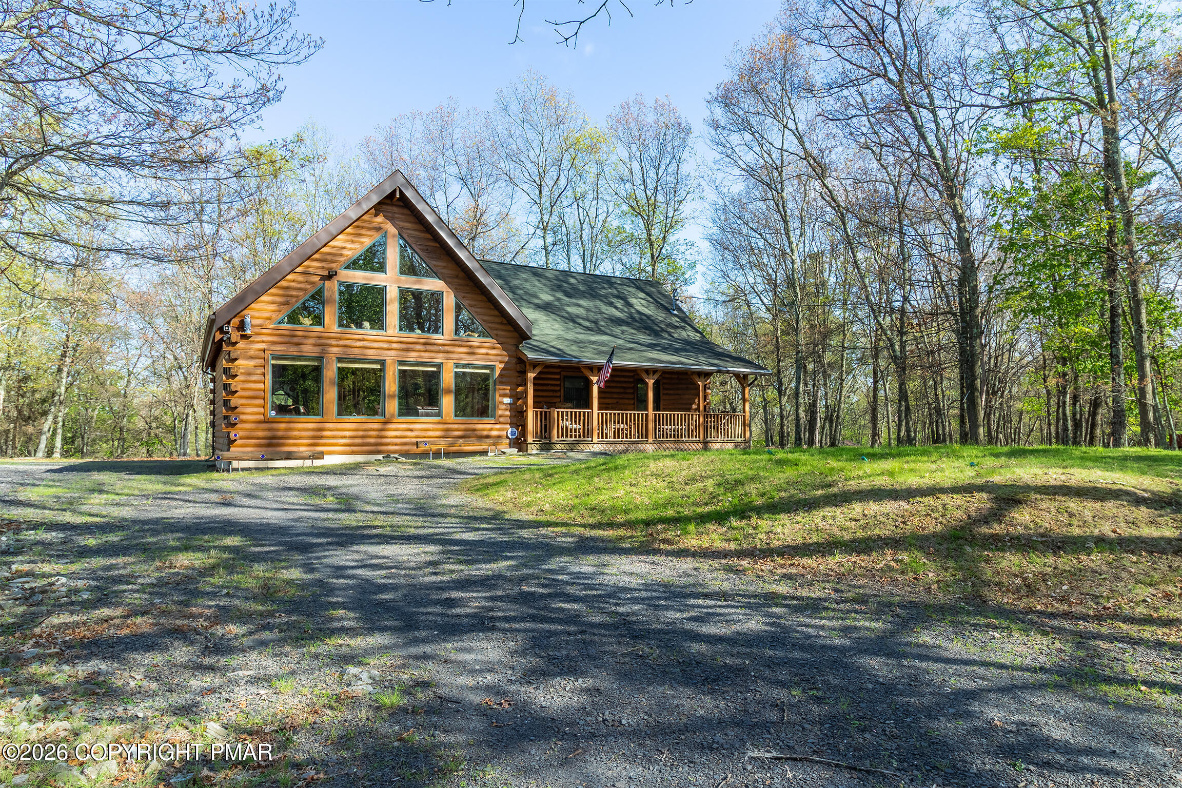 1160 Bluebird Lane Bushkill, PA 18324 - Photo 3 of 44 a front view of a house with a yard