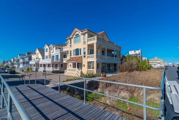 a view of a brick building next to a yard
